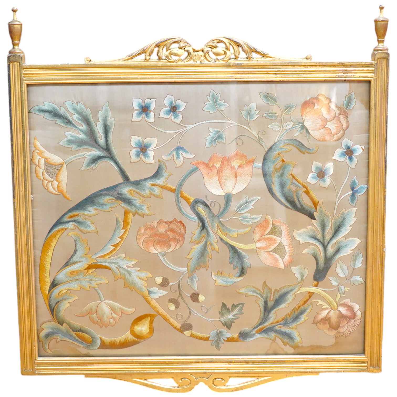 A 19th century Arts and Crafts floral polychrome silk embroidery on cream silk, in the William Morris style, in gilt painted frame. 76cm wide x 64cm high. Condition - two water marks to the top right side and bottom righ